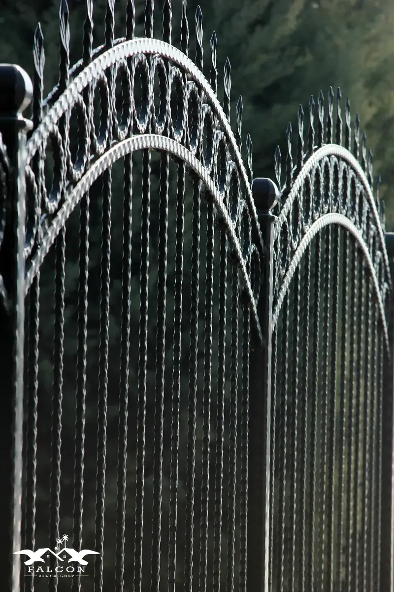 Fencing installation in San Diego featuring a decorative wrought iron fence with ornate detailing and a durable, elegant design—ideal for residential property boundaries, enhanced security, and long-lasting outdoor remodeling upgrades.
