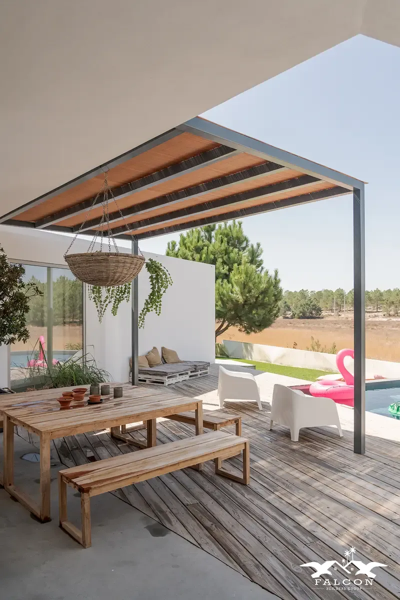 The photo shows an upgraded outdoor living space with a covered patio, wooden deck, outdoor seating, and a pool area—clearly aligning with outdoor remodeling rather than kitchen, bathroom, or full home interiors.
