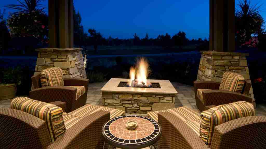 Fire pit centerpiece in a custom outdoor living area